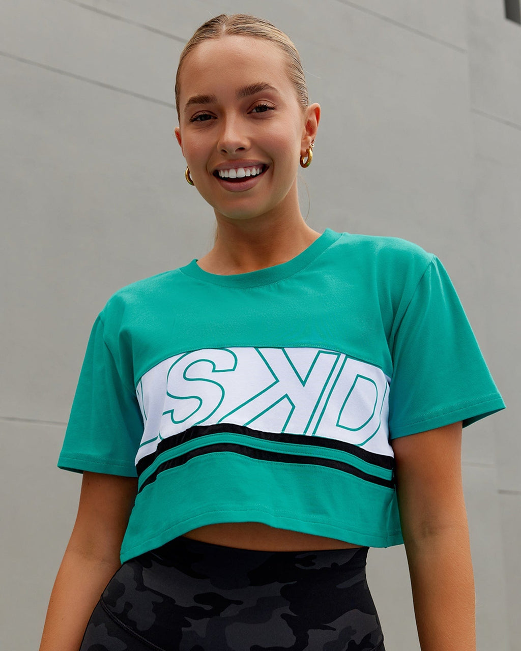 Model wearing Line-Up Cropped Tee - White-Hyper Teal