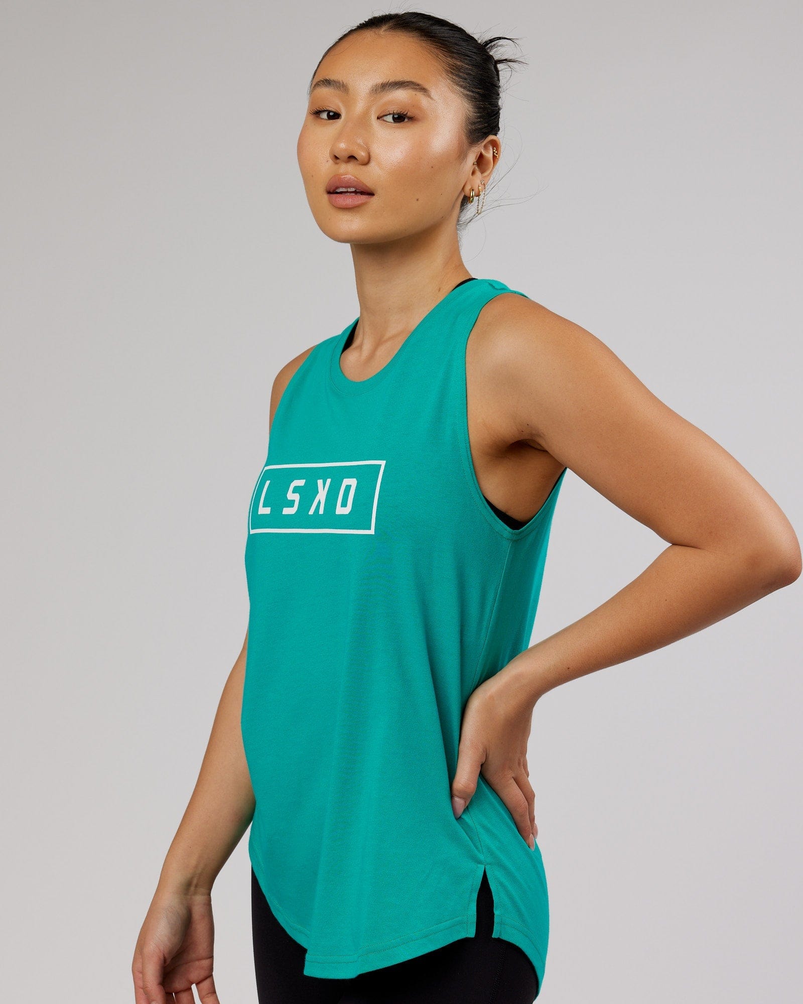 Model wearing Luna Tank - Hyper Teal
