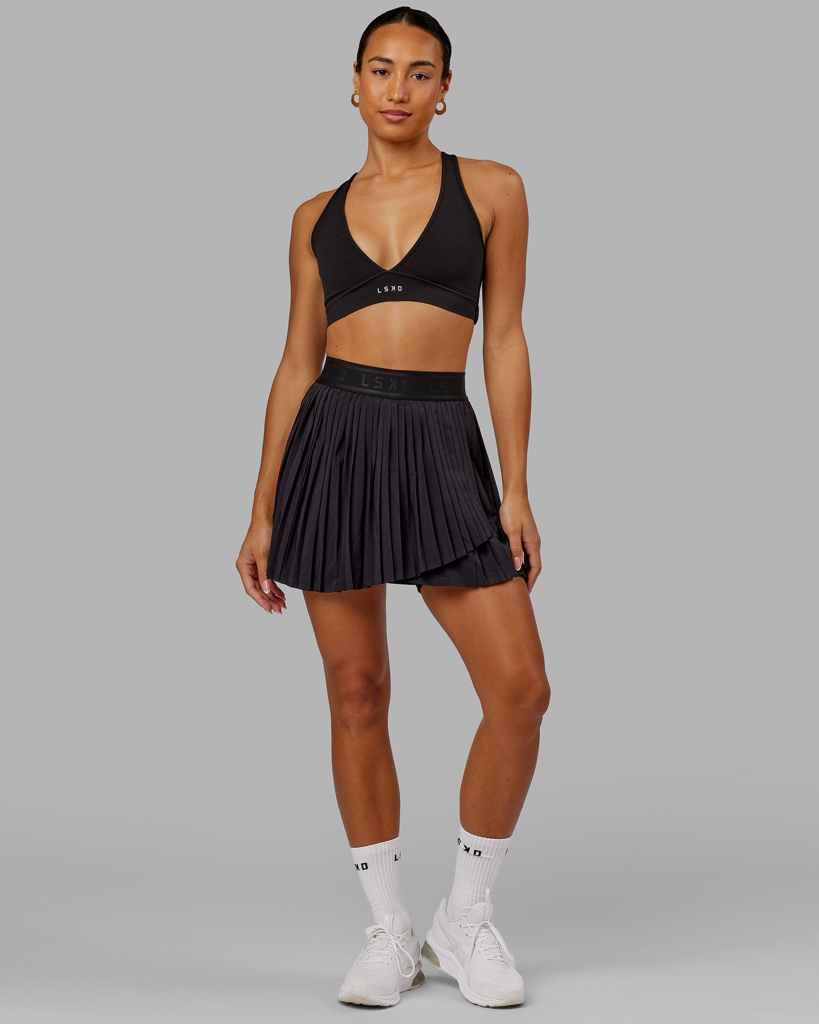 Model wearing Match Point Tennis Skirt - Black