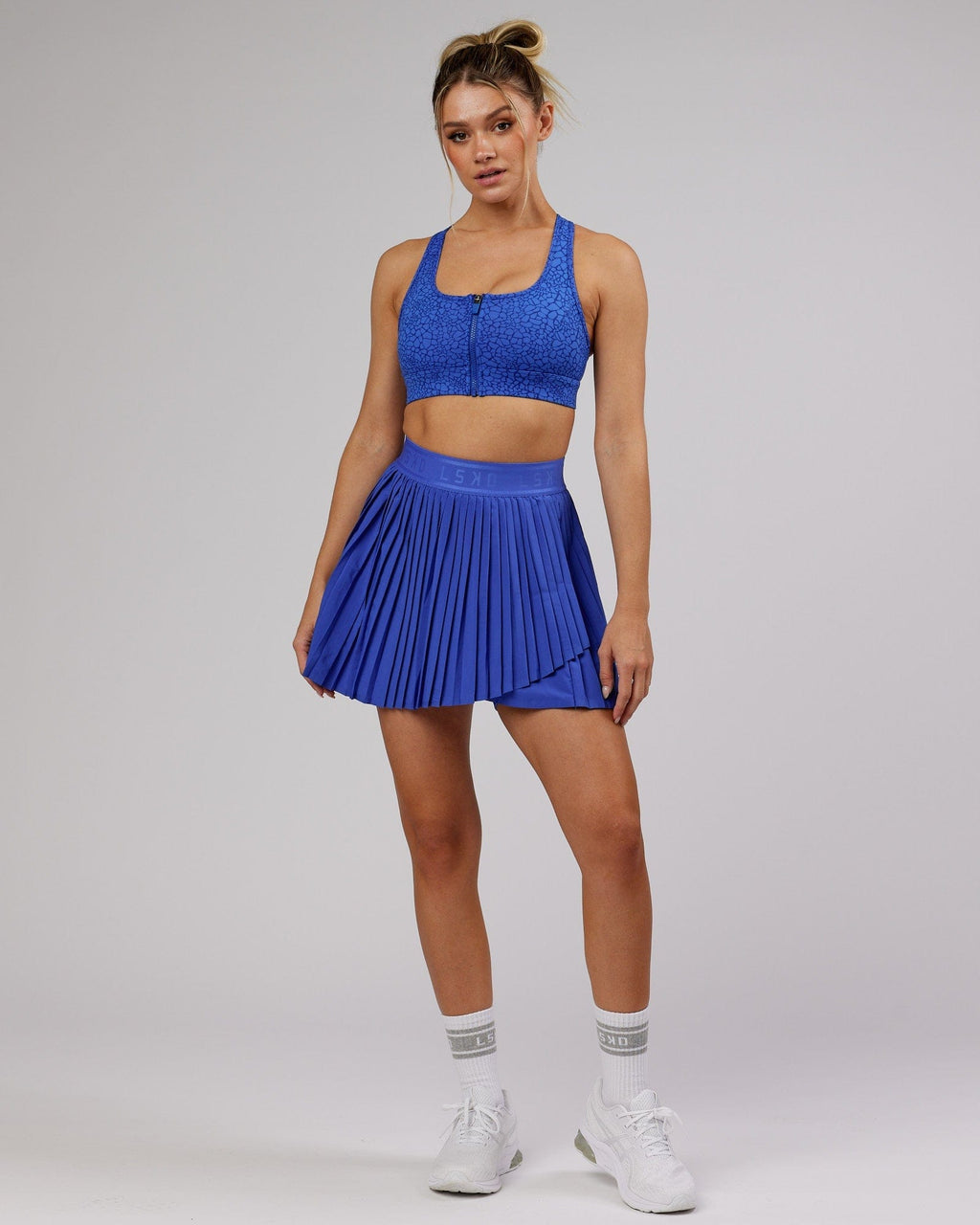 Model wearing Match Point Tennis Skirt - Power Cobalt