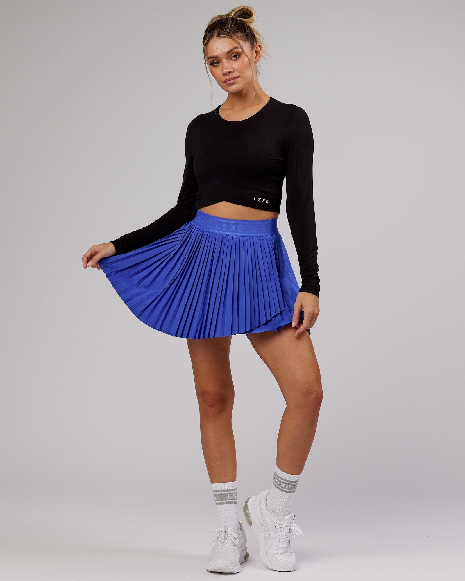Model wearing Match Point Tennis Skirt - Power Cobalt