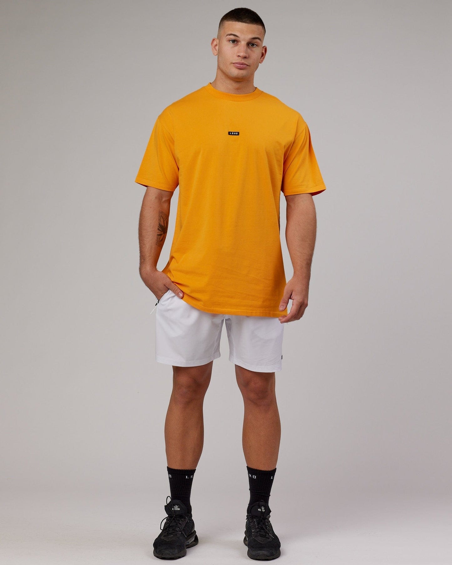 Model wearing Fundamental FLXCotton Tee Longline Oversize - Butterscotch