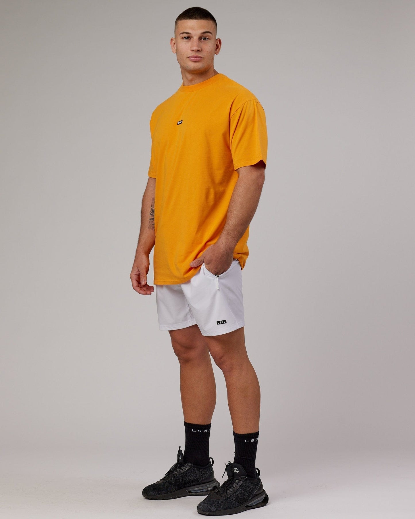 Model wearing Fundamental FLXCotton Tee Longline Oversize - Butterscotch