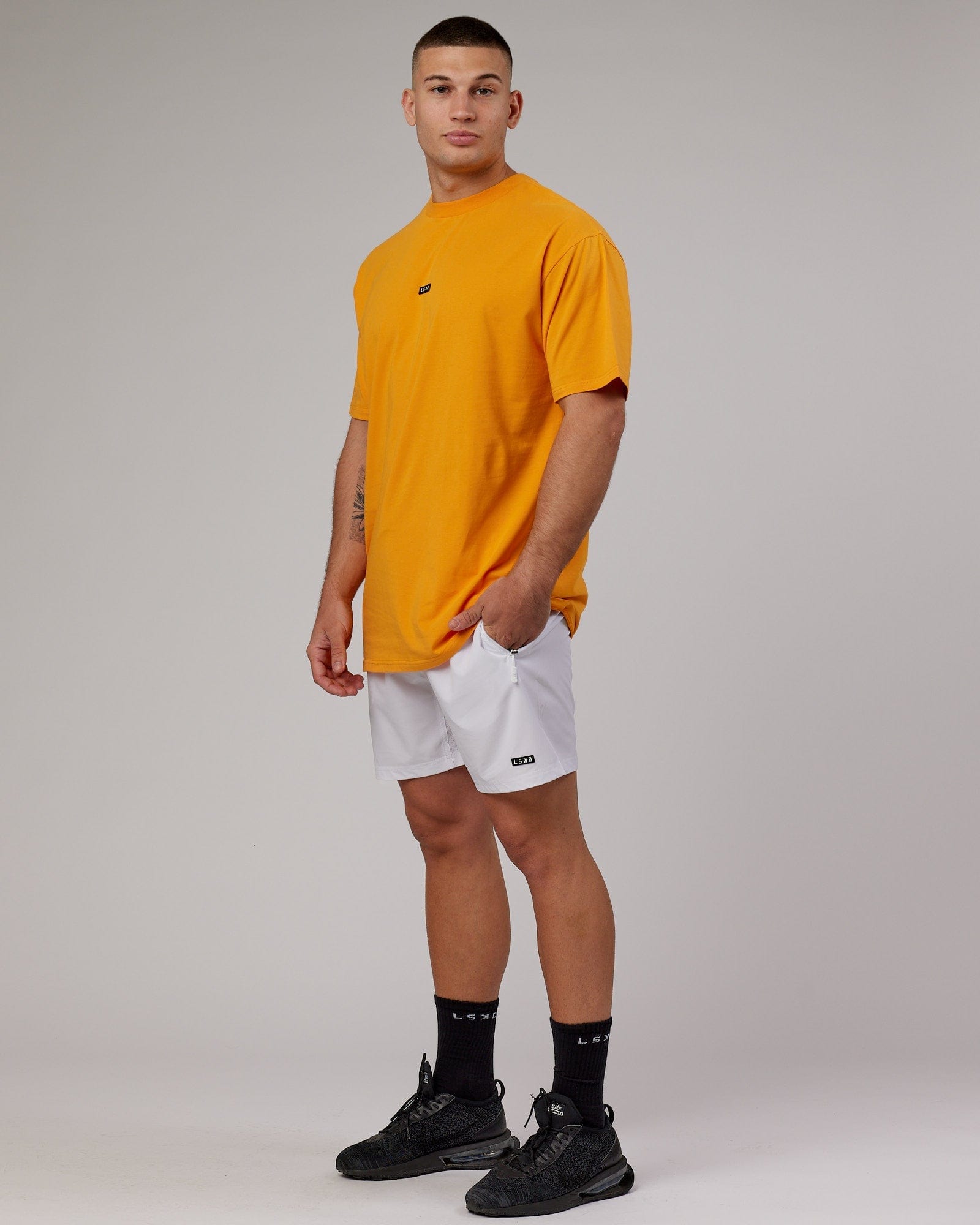 Model wearing Fundamental FLXCotton Tee Longline Oversize - Butterscotch