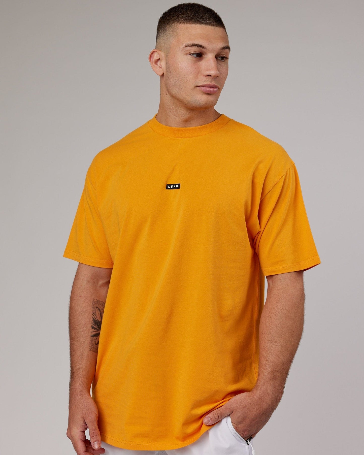 Model wearing Fundamental FLXCotton Tee Longline Oversize - Butterscotch