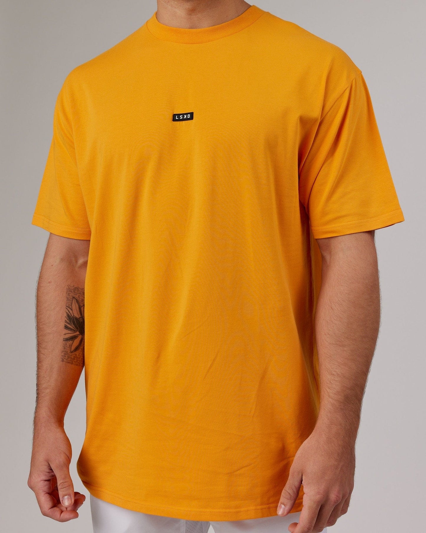 Model wearing Fundamental FLXCotton Tee Longline Oversize - Butterscotch
