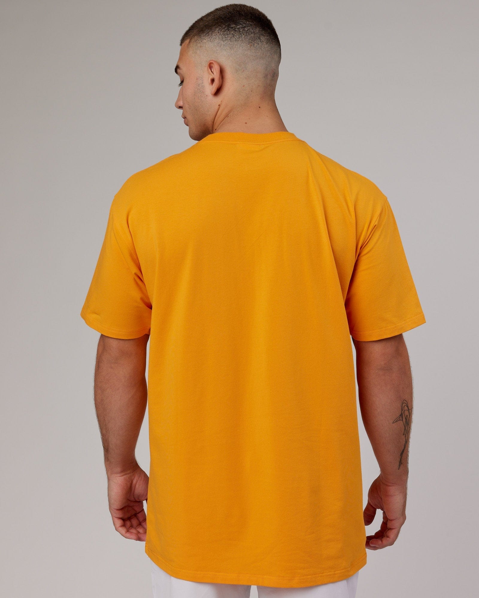 Model wearing Fundamental FLXCotton Tee Longline Oversize - Butterscotch