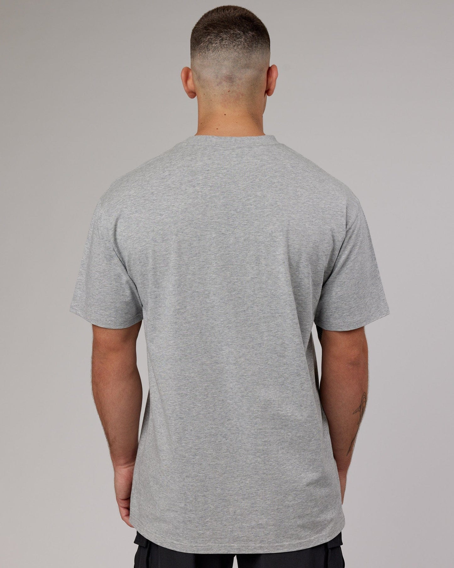 Model wearing Fundamental FLXCotton Tee Longline Oversize - Light Grey Marl