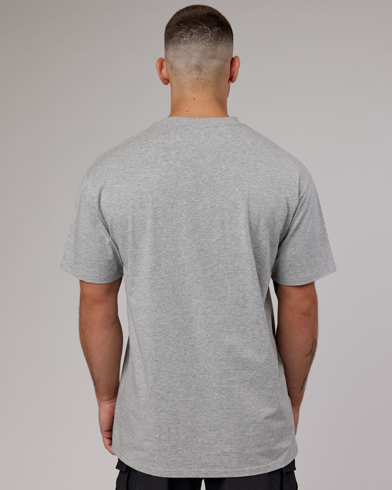 Model wearing Fundamental FLXCotton Tee Longline Oversize - Light Grey Marl