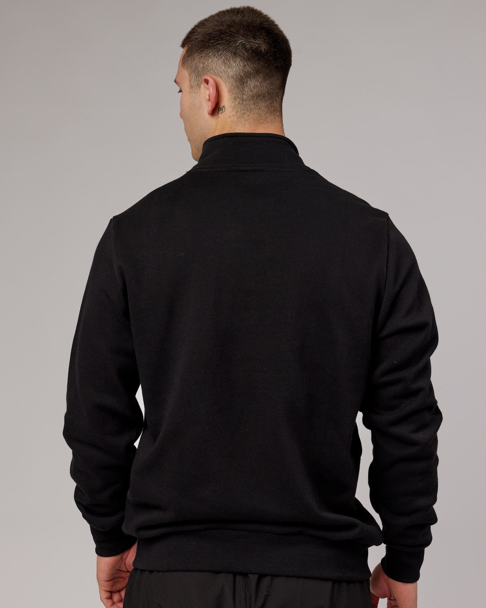Model wearing Victory 1/4 Zip Sweater Oversize - Black