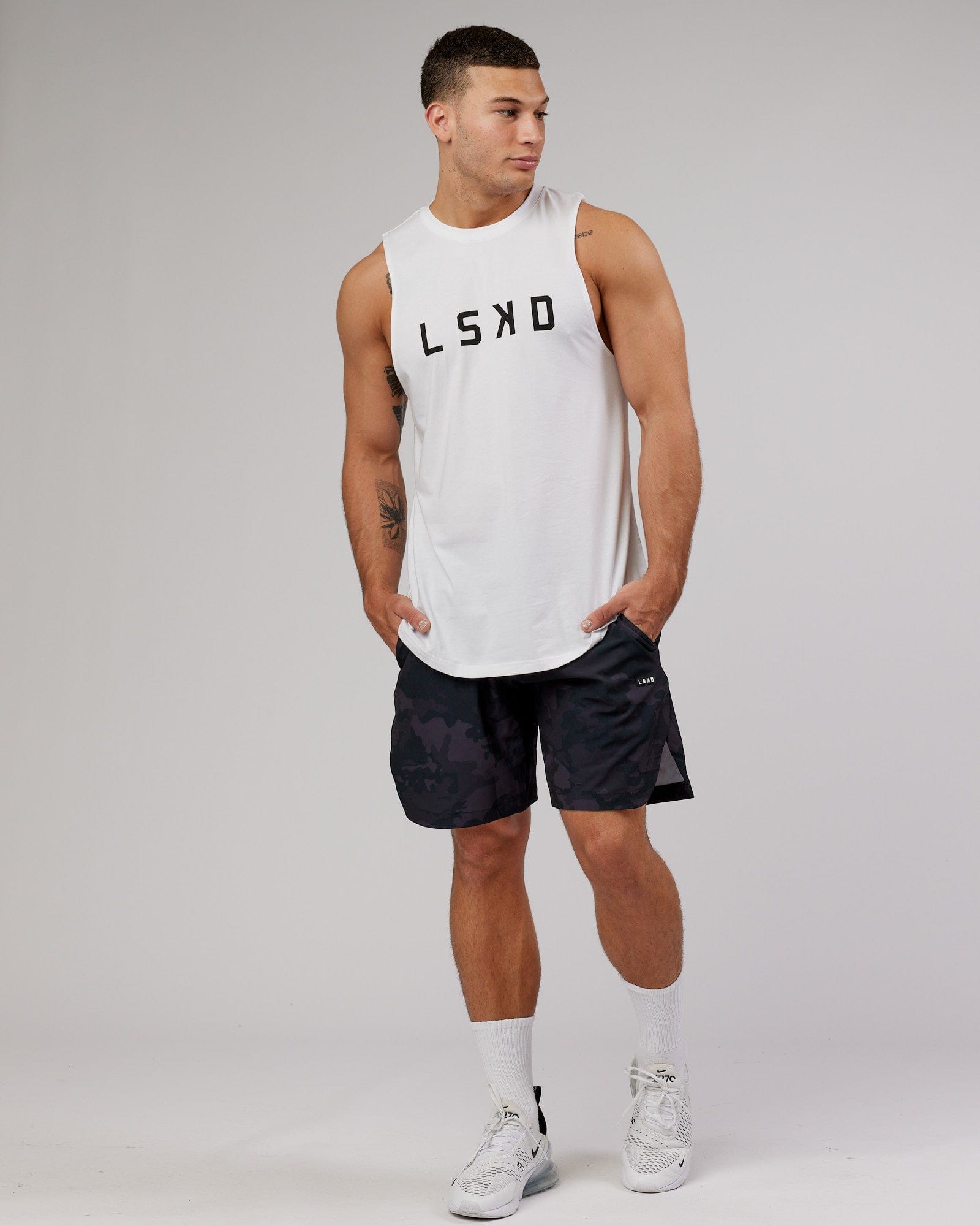 Model wearing Competition 8" Performance Short - Black Camo