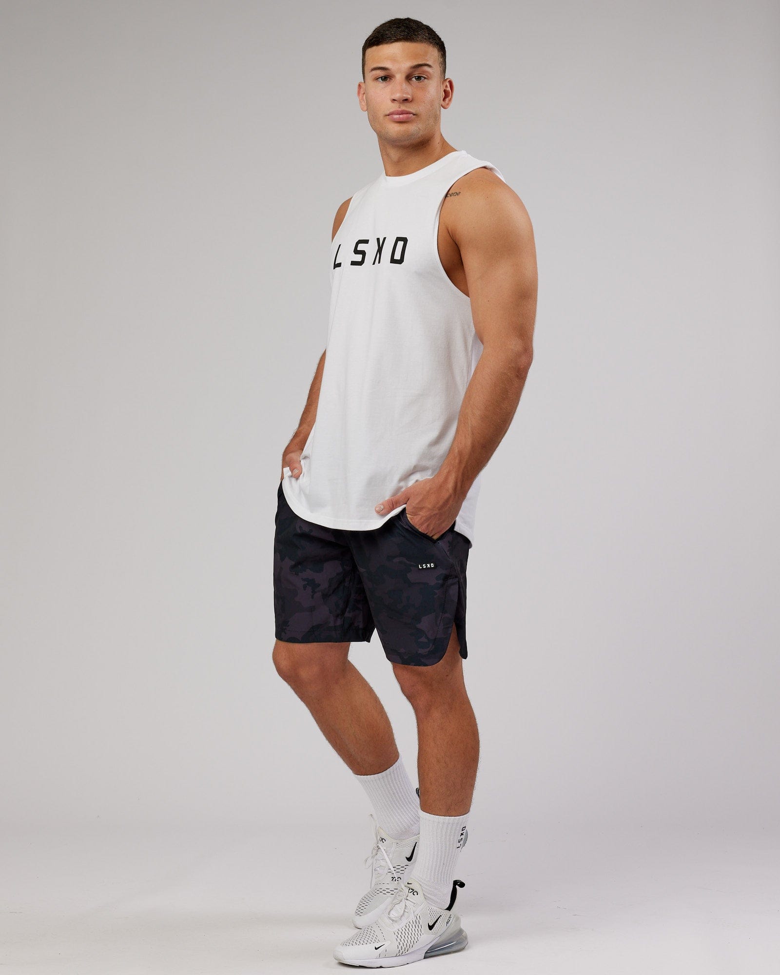 Model wearing Competition 8" Performance Short - Black Camo