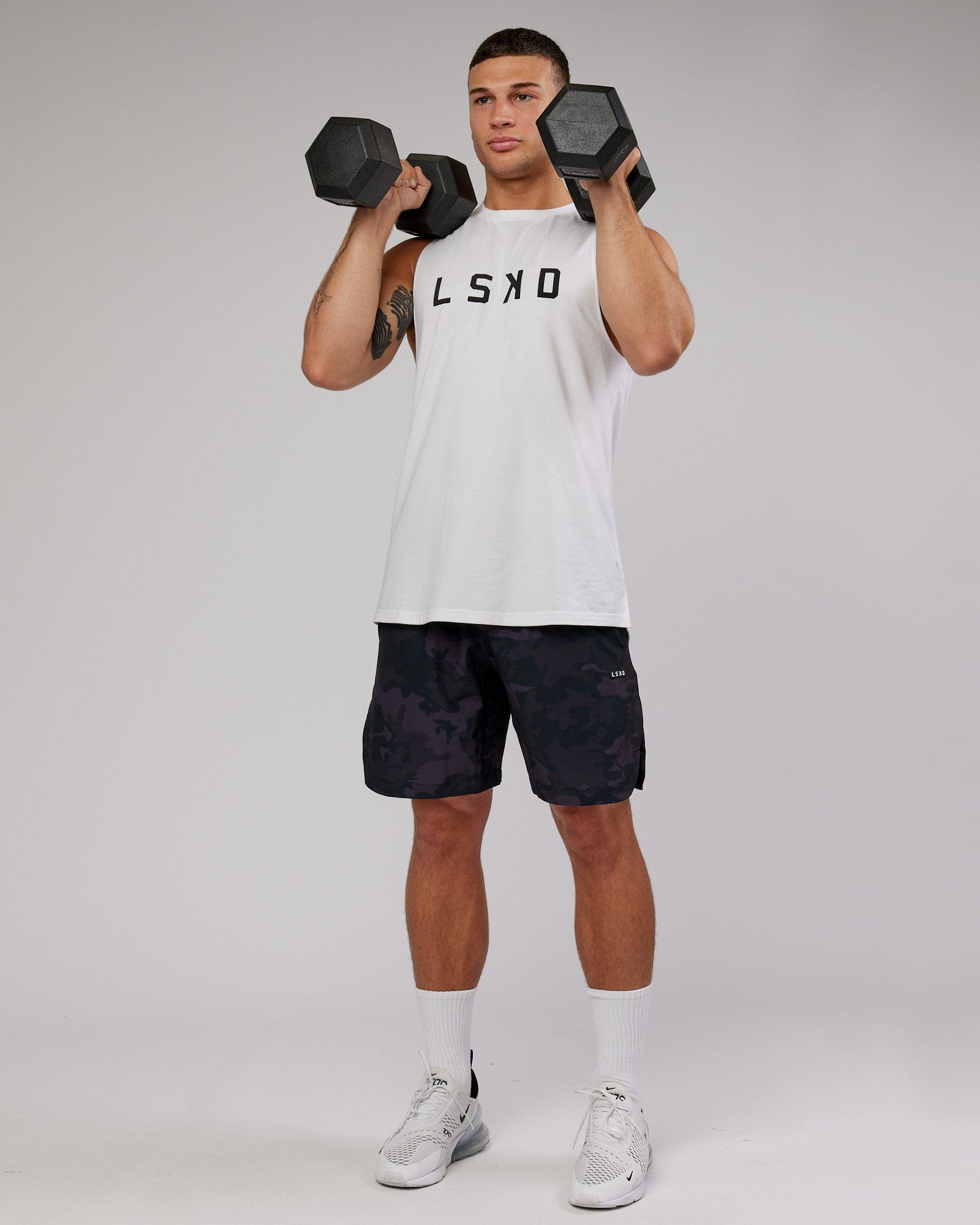 Model wearing Competition 8" Performance Short - Black Camo