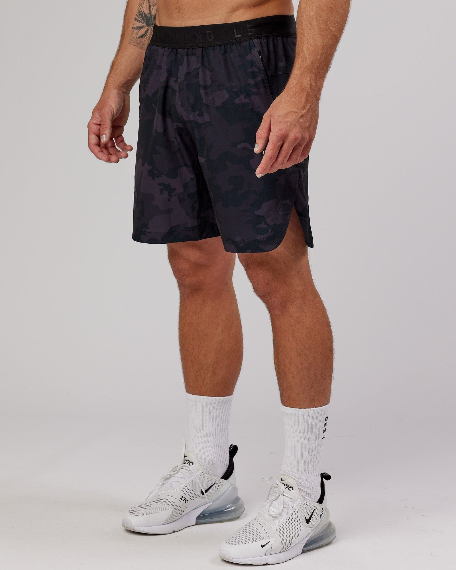 Model wearing Competition 8" Performance Short - Black Camo