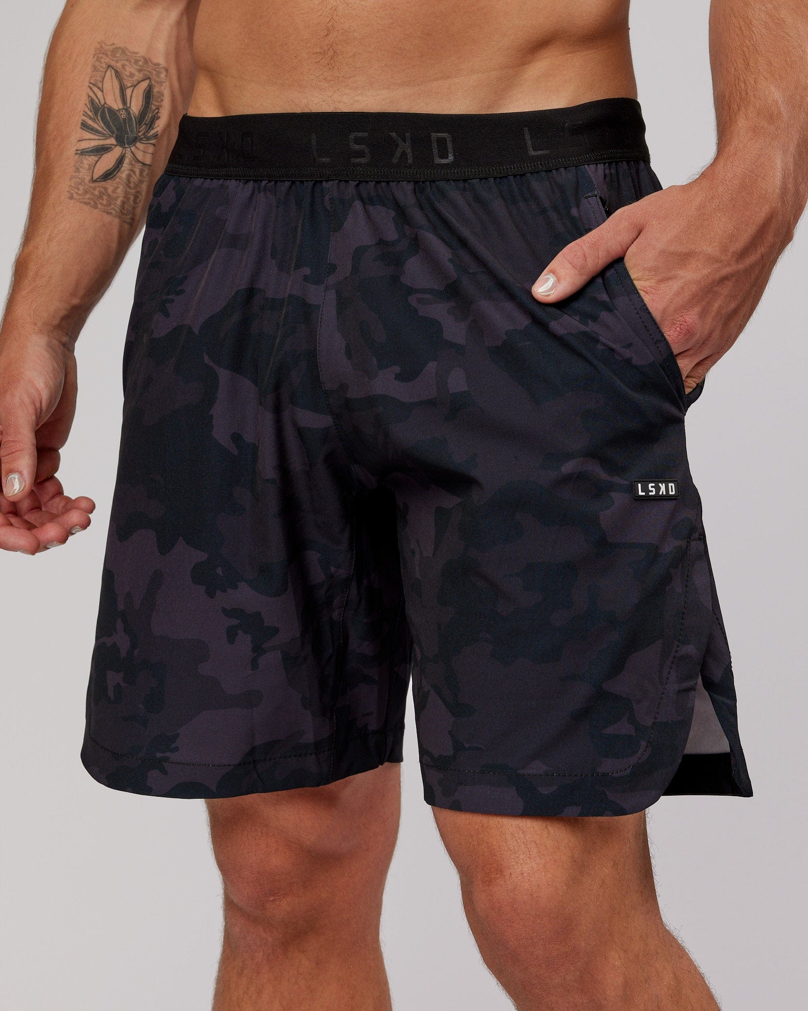 Model wearing Competition 8" Performance Short - Black Camo