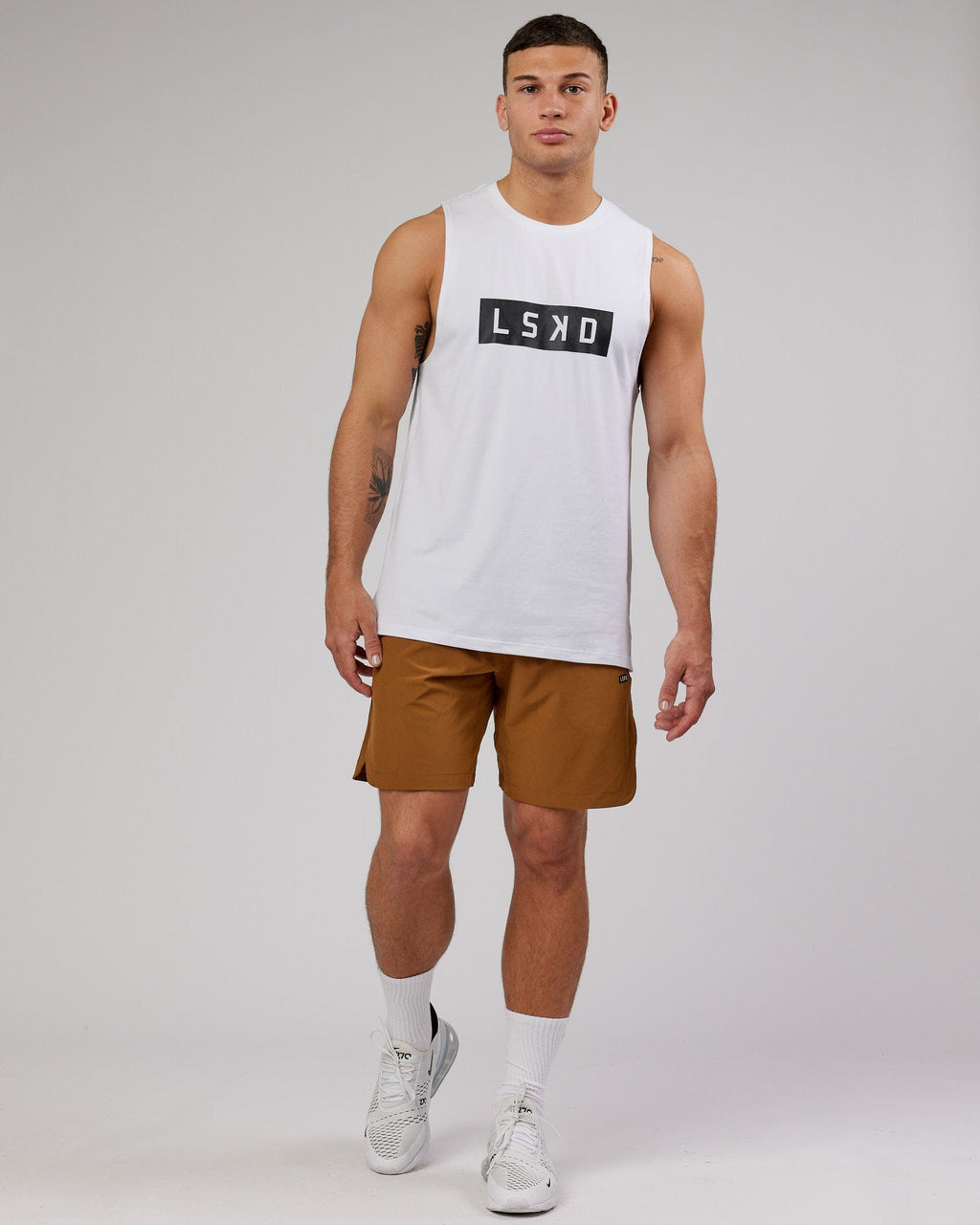 Model wearing Competition 8" Performance Short - Camel