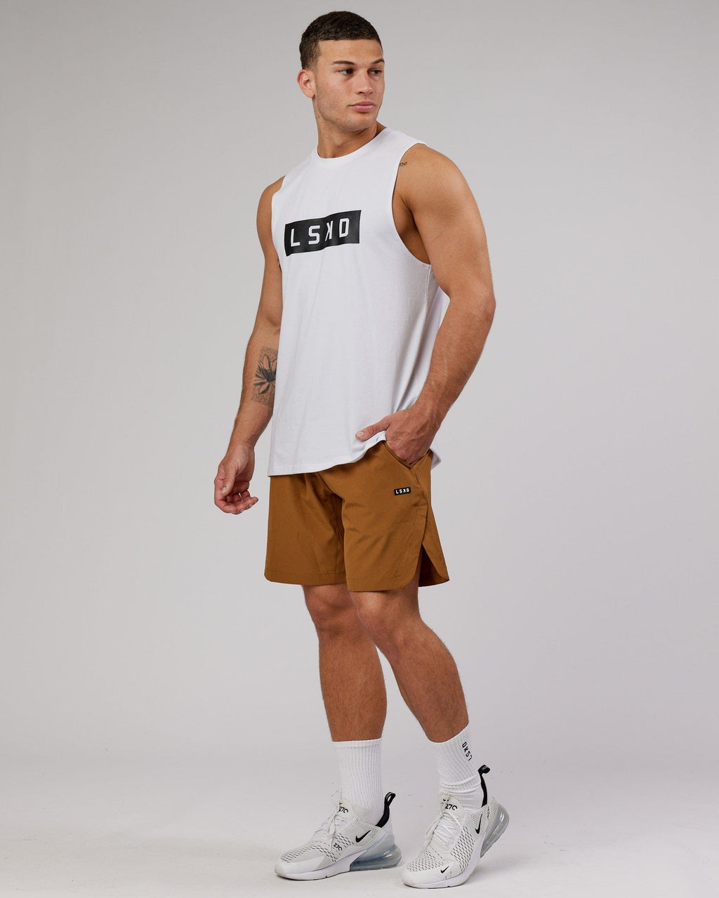 Model wearing Competition 8" Performance Short - Camel