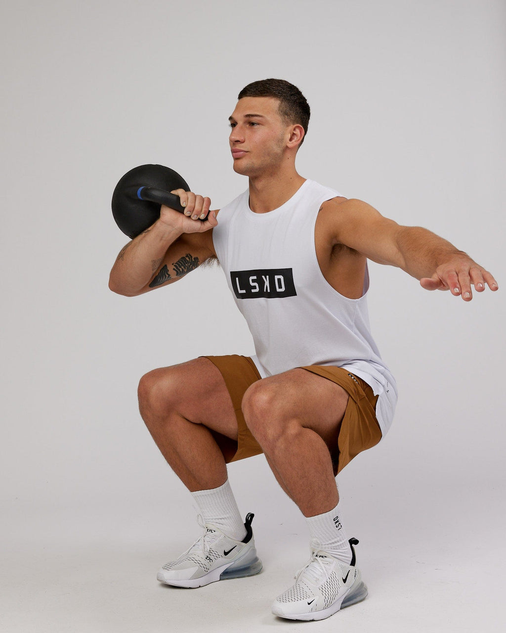 Model wearing Competition 8" Performance Short - Camel