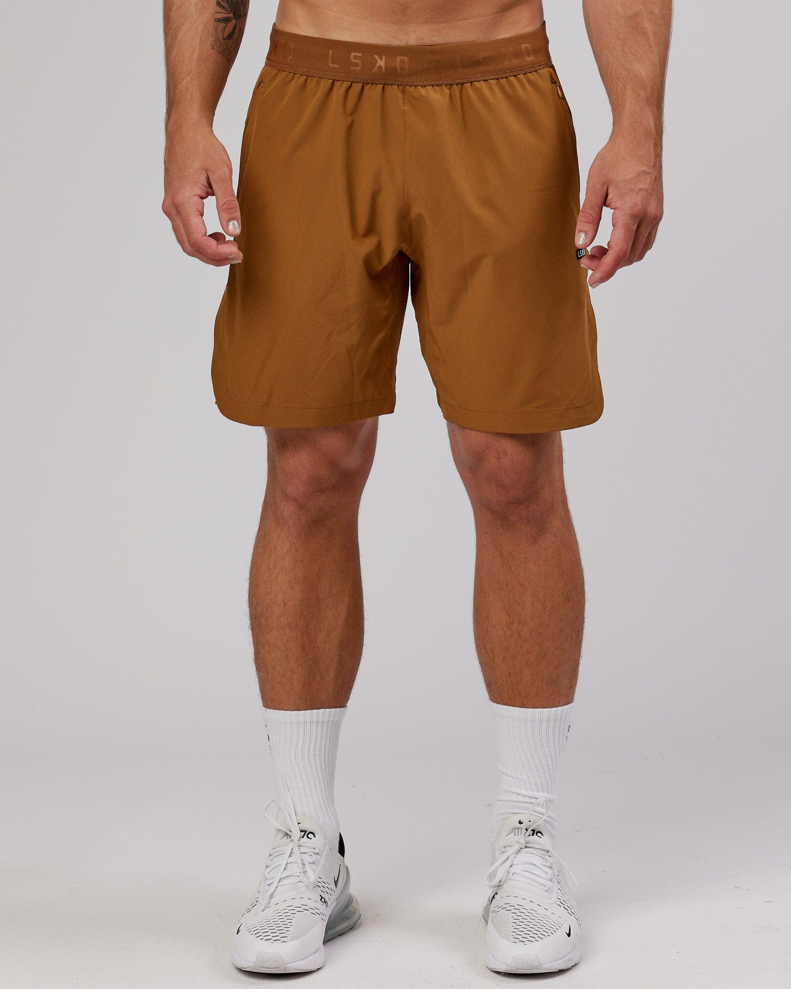 Model wearing Competition 8" Performance Short - Camel