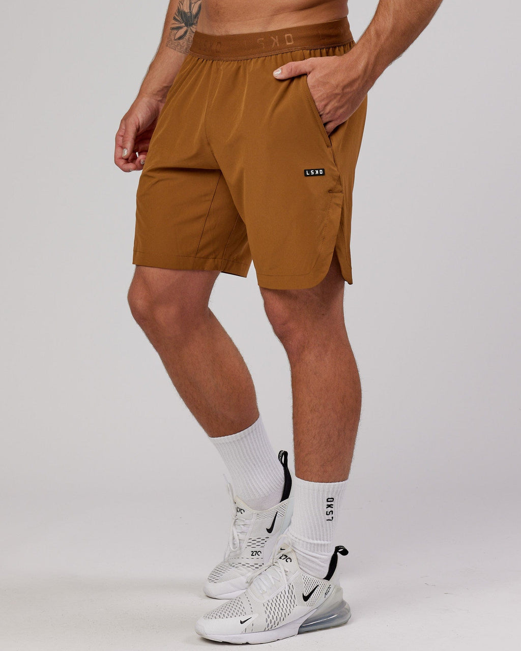 Model wearing Competition 8" Performance Short - Camel