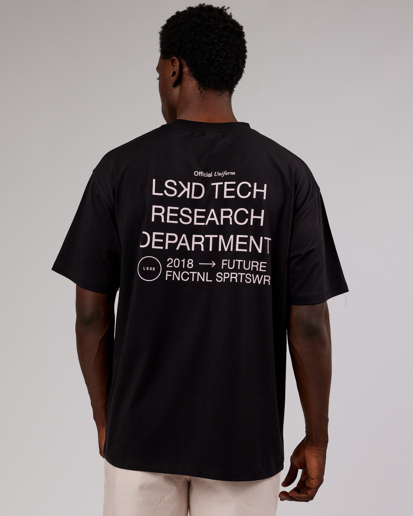 Model wearing LTRD FLXCotton Tee Oversize - Black-Pink