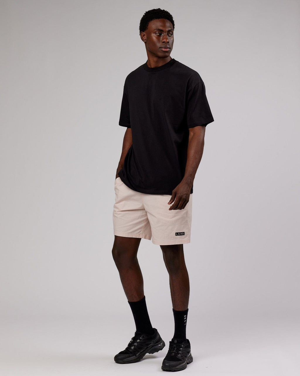 Model wearing LTRD FLXCotton Tee Oversize - Black-Pink