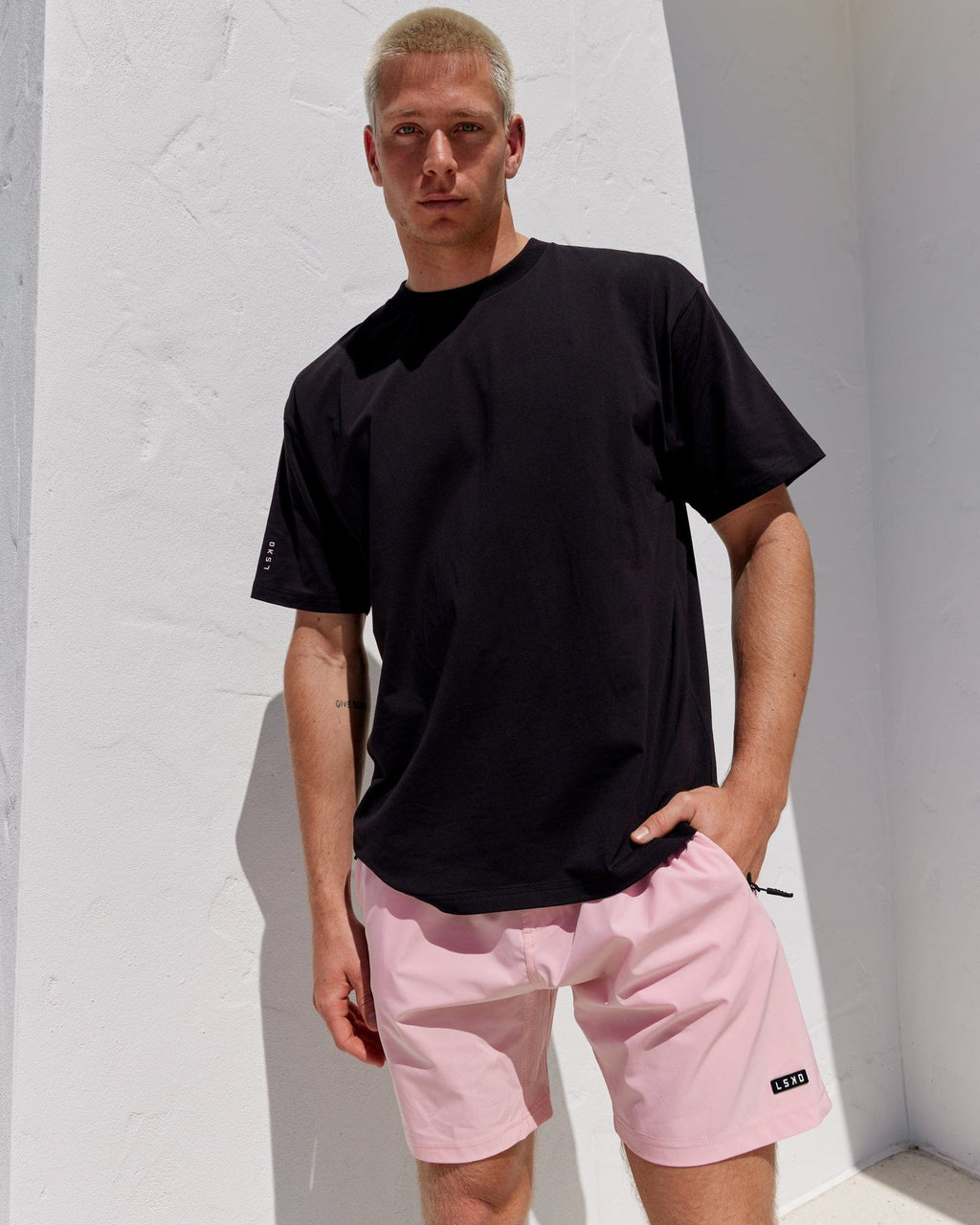 Model wearing LTRD FLXCotton Tee Oversize - Black-Pink
