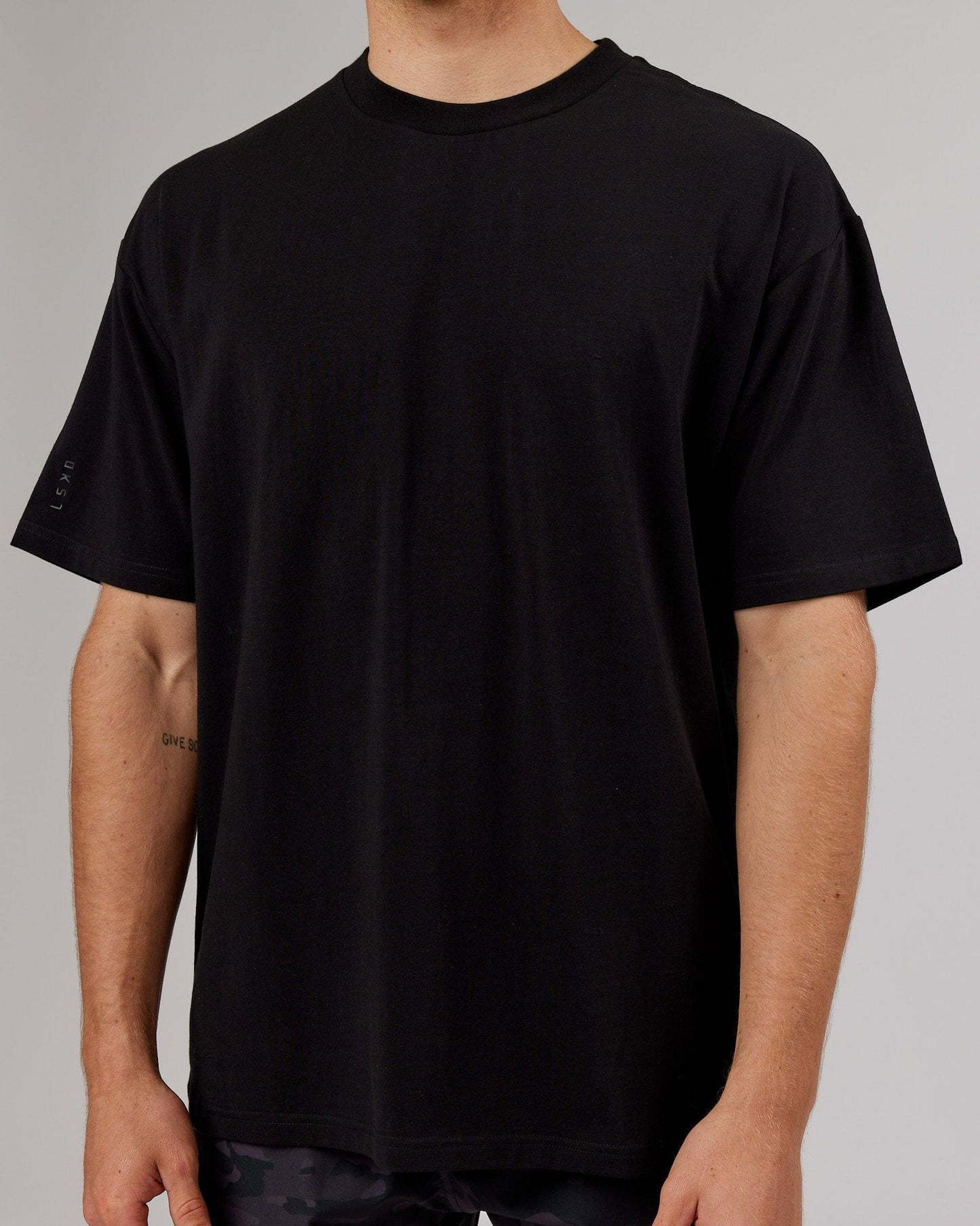 Model wearing LTRD FLXCotton Tee Oversize - Black-Black