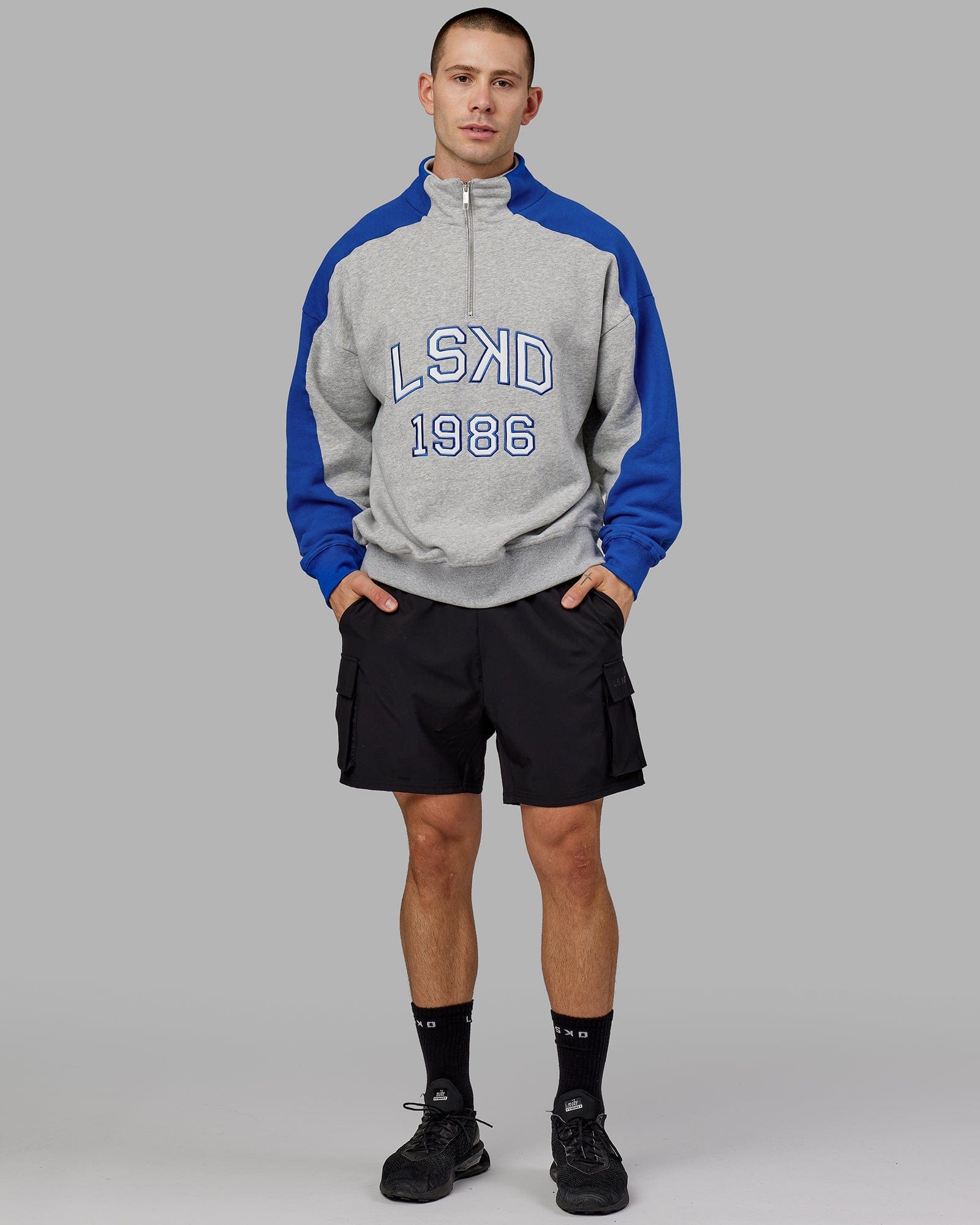 Model wearing Alumni 1/4 Zip Sweater Oversize - Grey-Blue