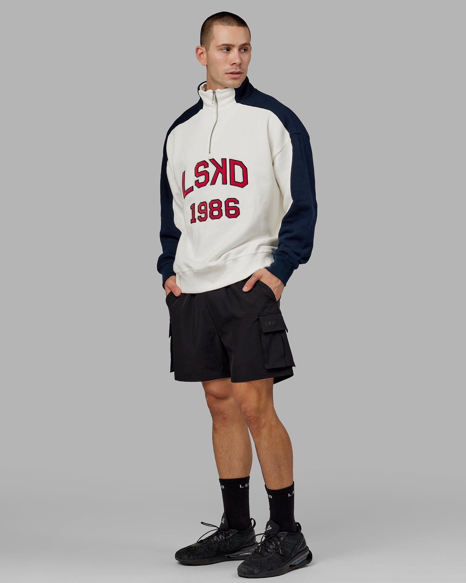Model wearing Alumni 1/4 Zip Sweater Oversize - Navy-Red