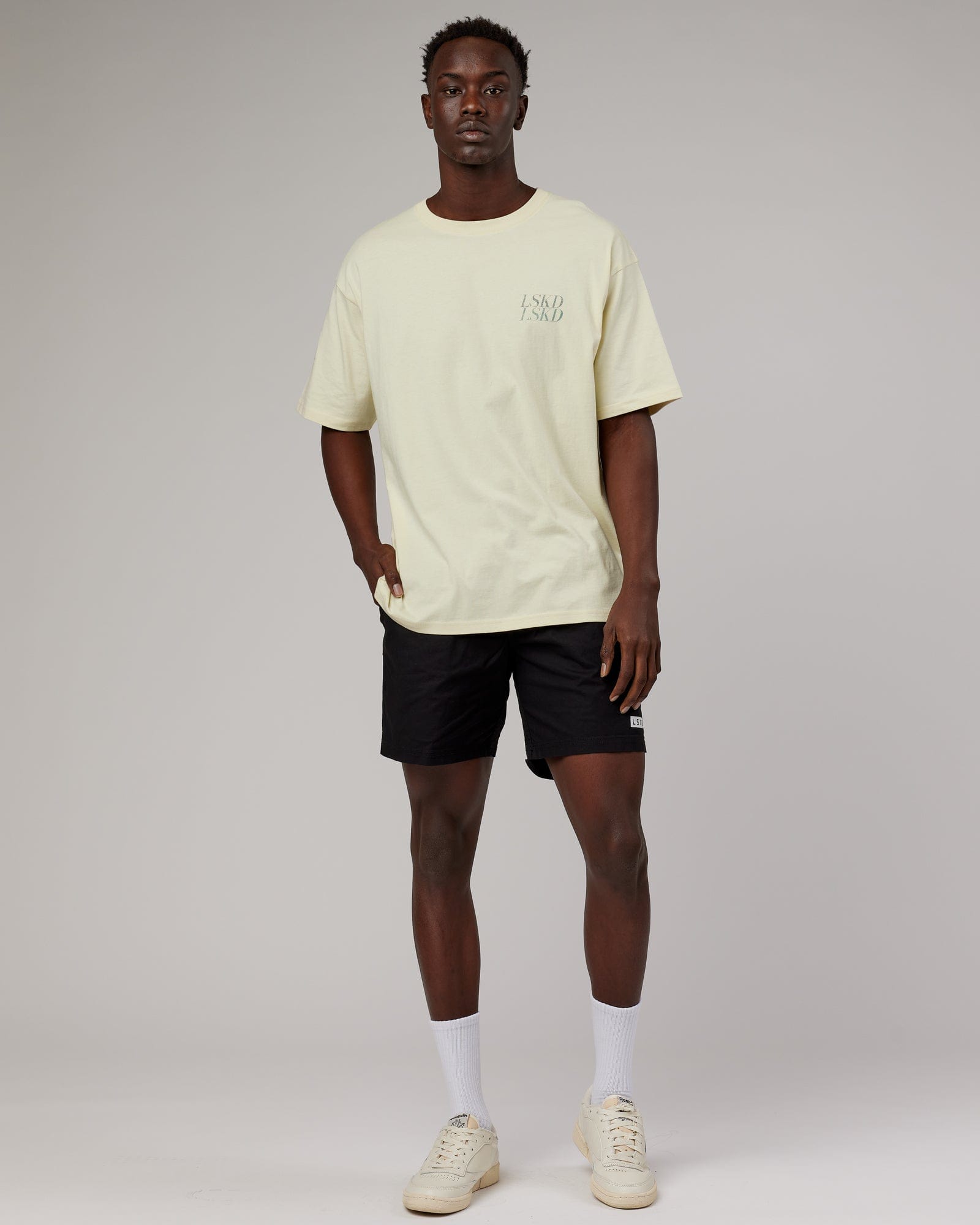 Model wearing Unisex Aurora Oversize Tee - Almond Milk