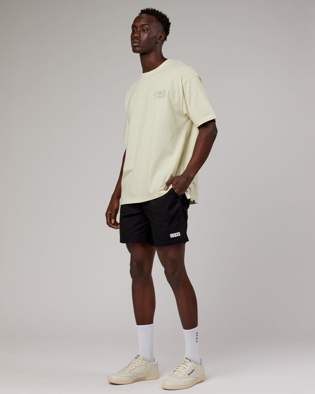 Model wearing Unisex Aurora Oversize Tee - Almond Milk