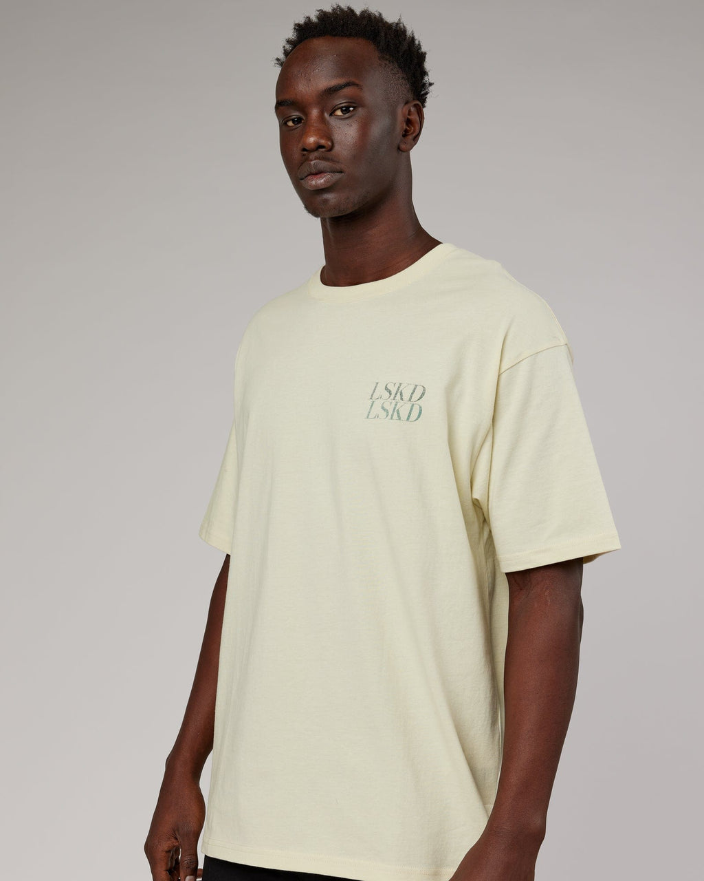 Model wearing Unisex Aurora Oversize Tee - Almond Milk