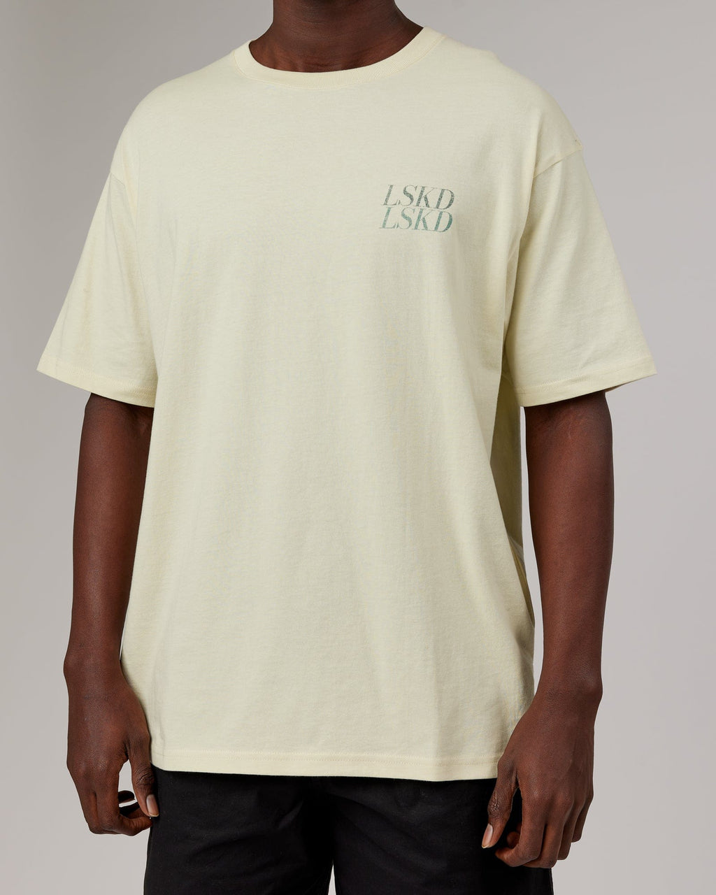 Model wearing Unisex Aurora Oversize Tee - Almond Milk