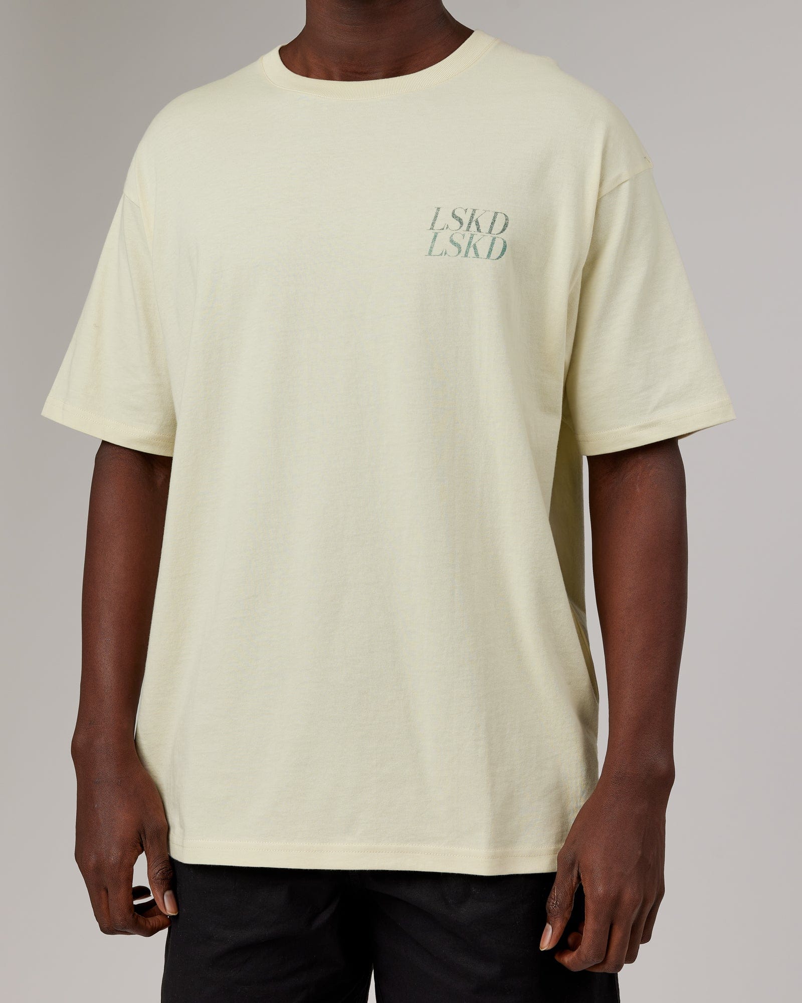 Model wearing Unisex Aurora Oversize Tee - Almond Milk