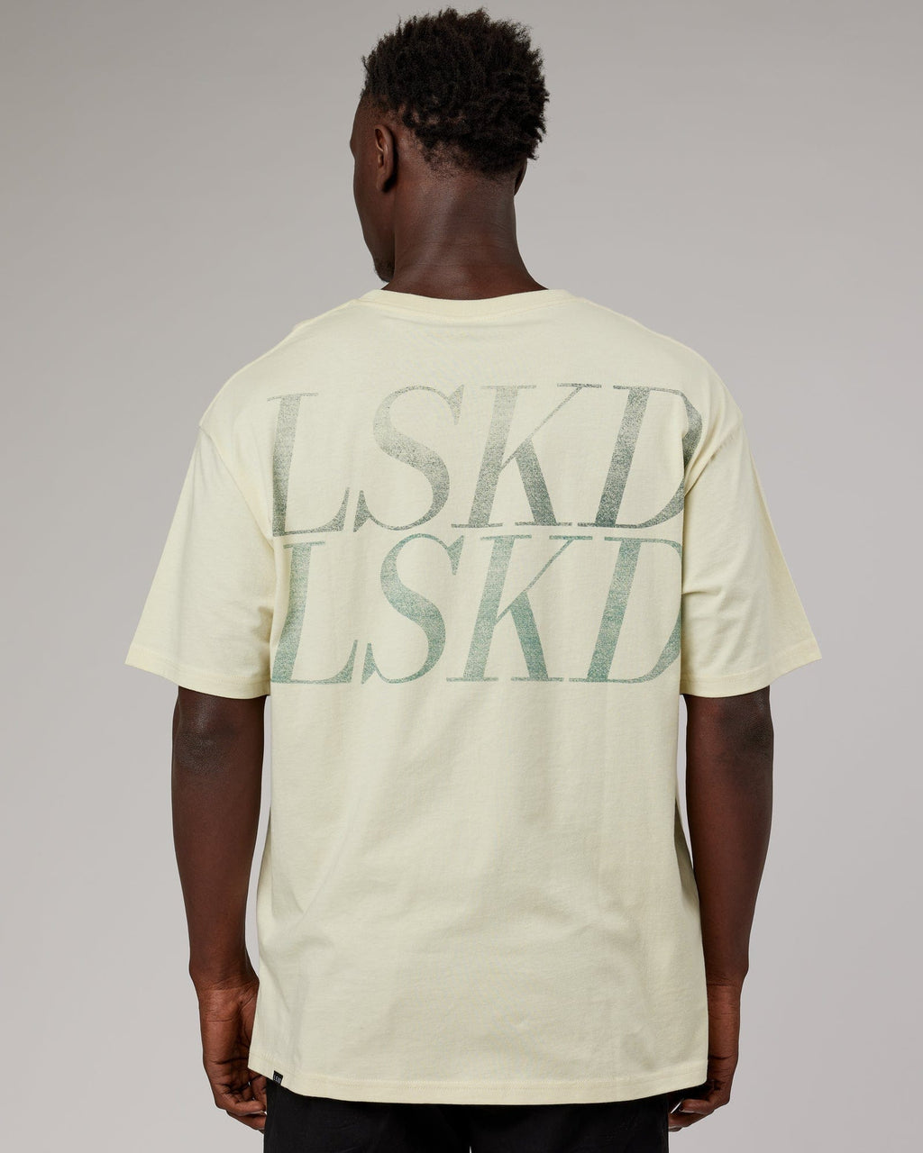 Model wearing Unisex Aurora Oversize Tee - Almond Milk