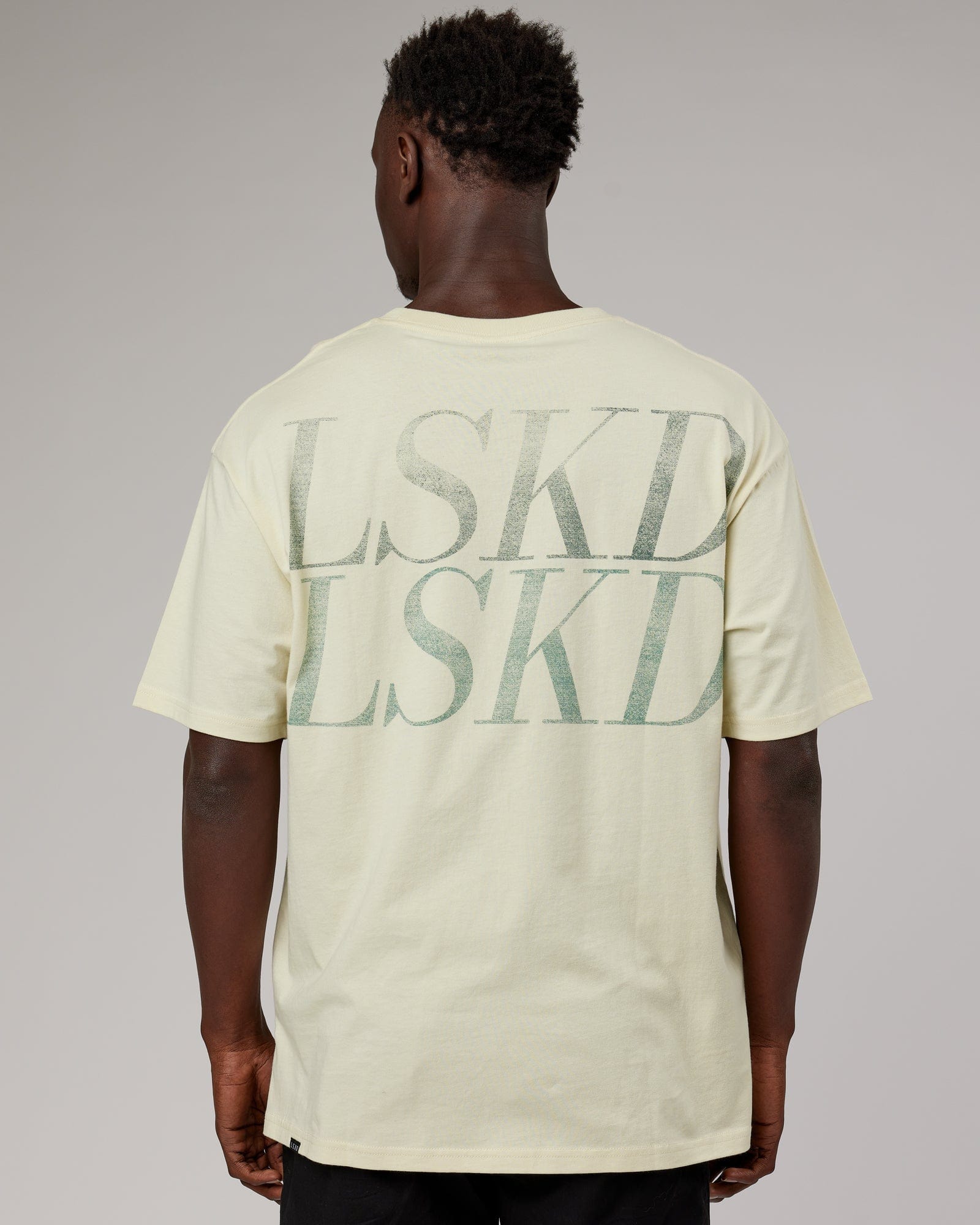 Model wearing Unisex Aurora Oversize Tee - Almond Milk