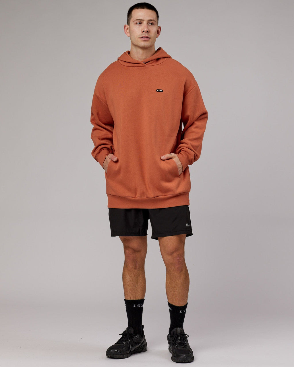 Model wearing Capsule Hoodie Oversize - Auburn