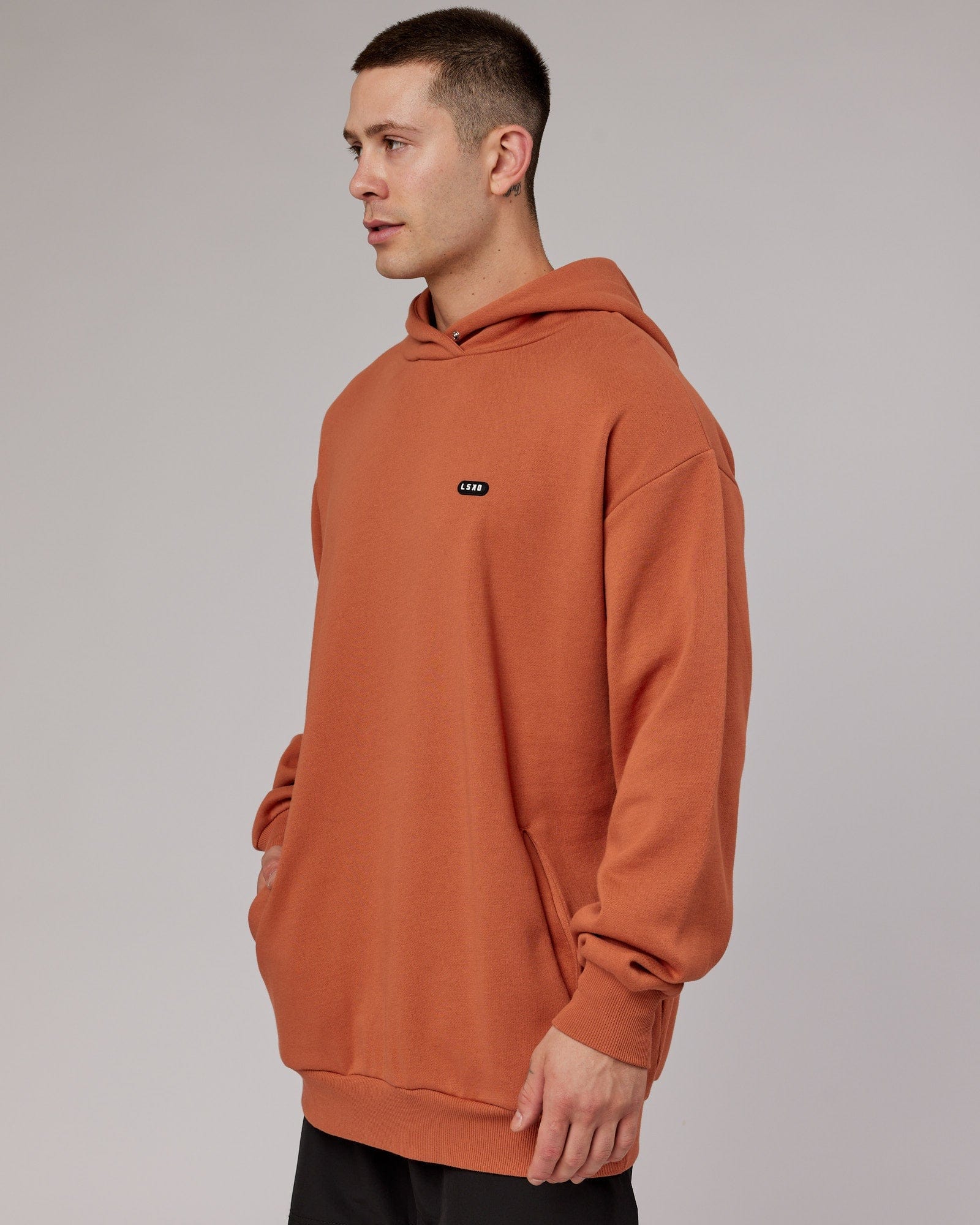 Model wearing Capsule Hoodie Oversize - Auburn