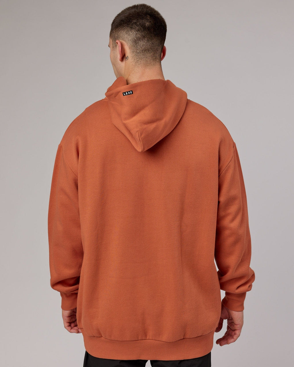 Model wearing Capsule Hoodie Oversize - Auburn