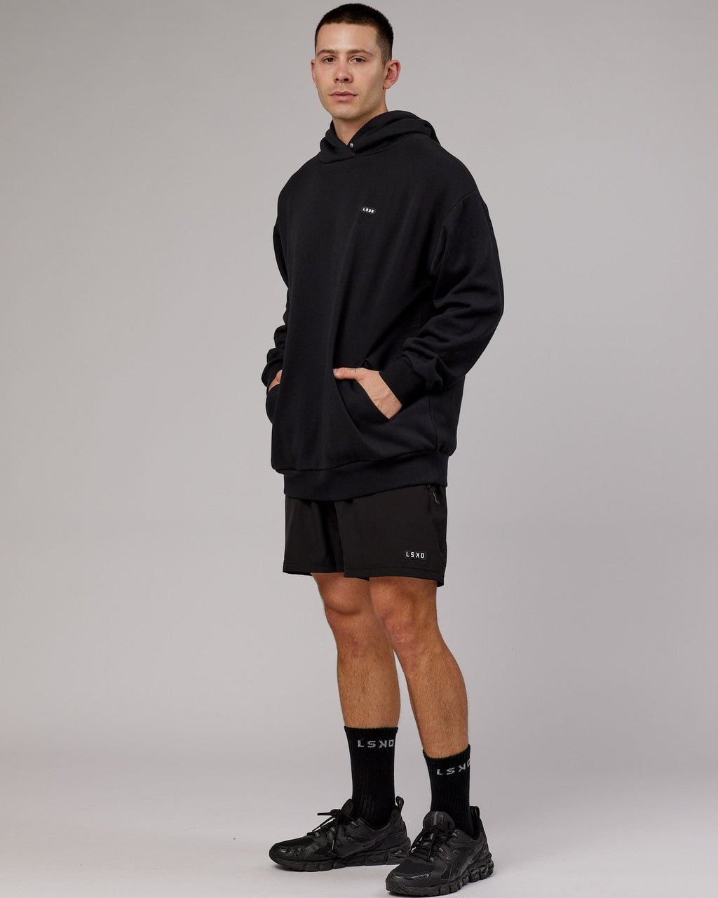 Model wearing Capsule Hoodie Oversize - Black