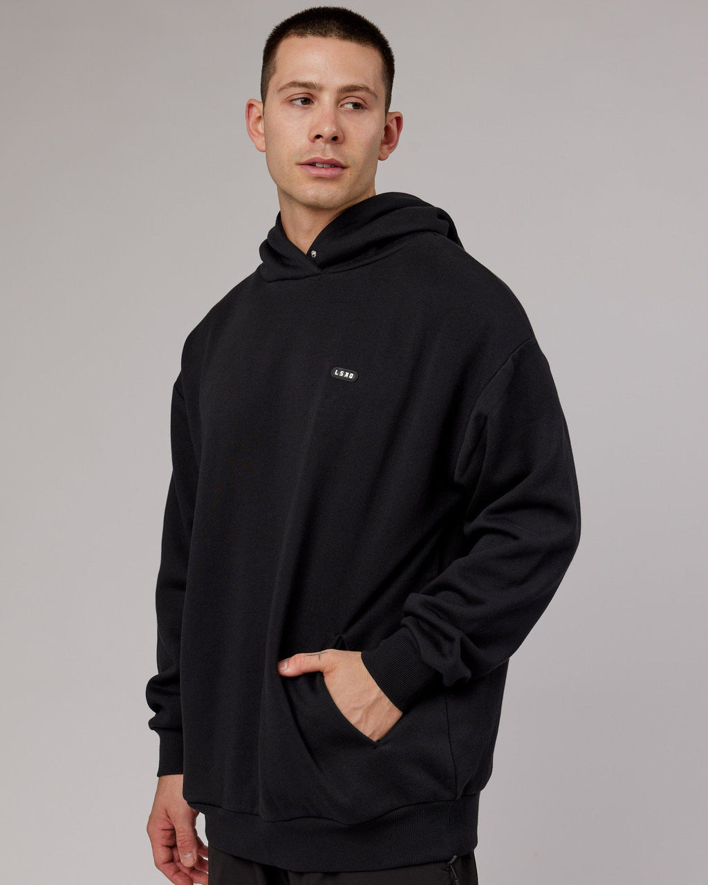 Model wearing Capsule Hoodie Oversize - Black