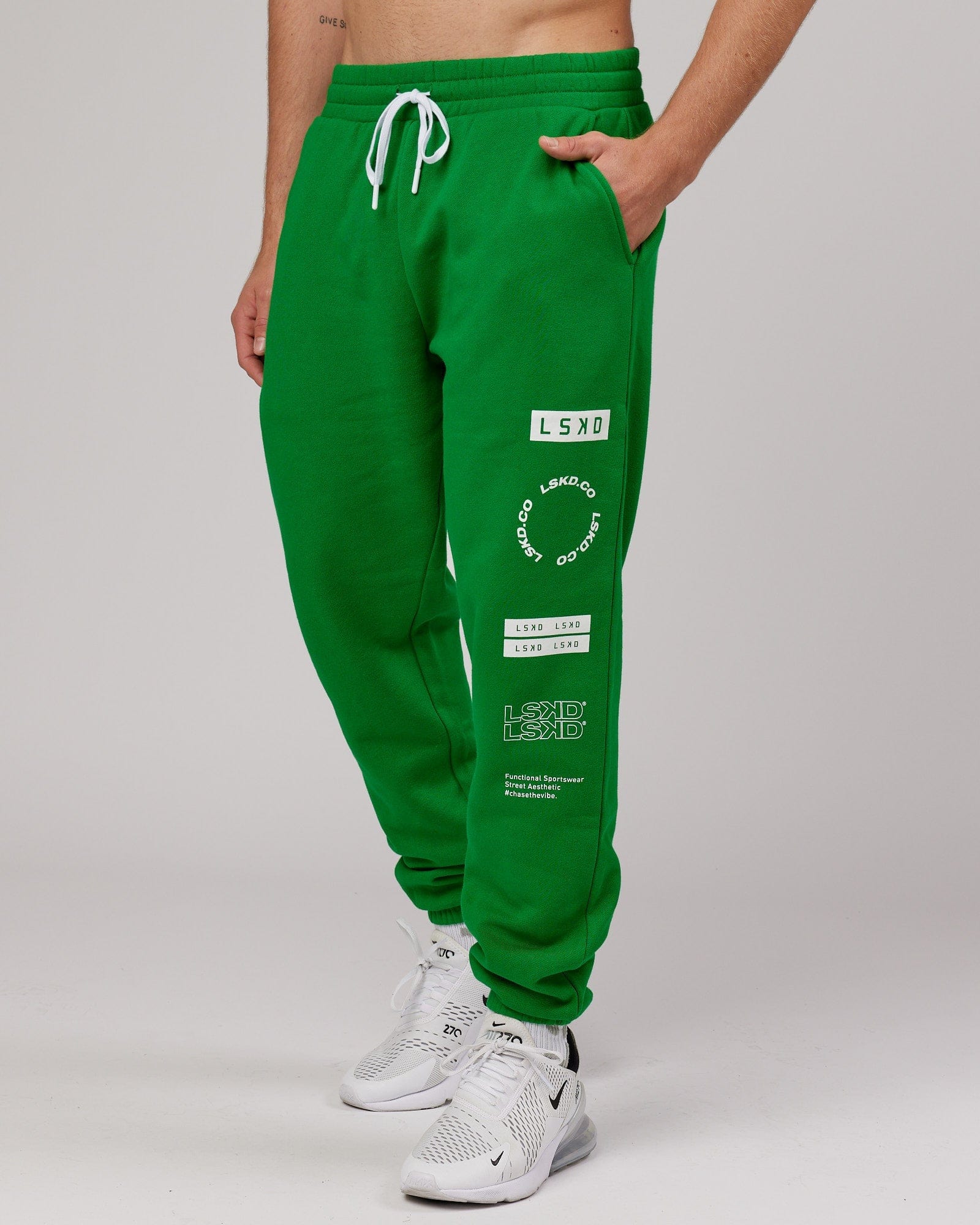 Model wearing Combo Track Pant - Vivid Green