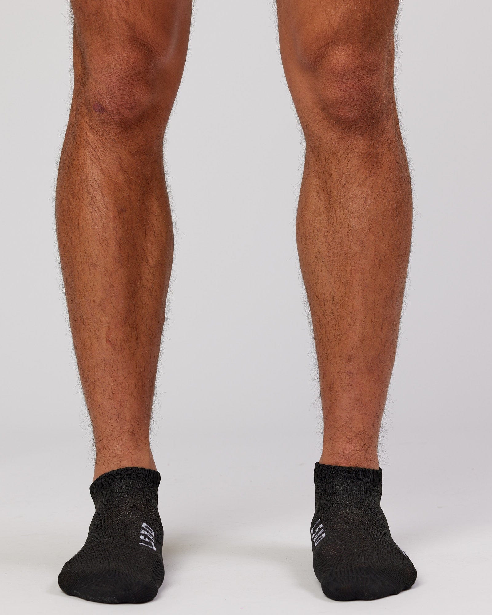 Model wearing Mens 3 Pack Covert Ankle Sock - Black