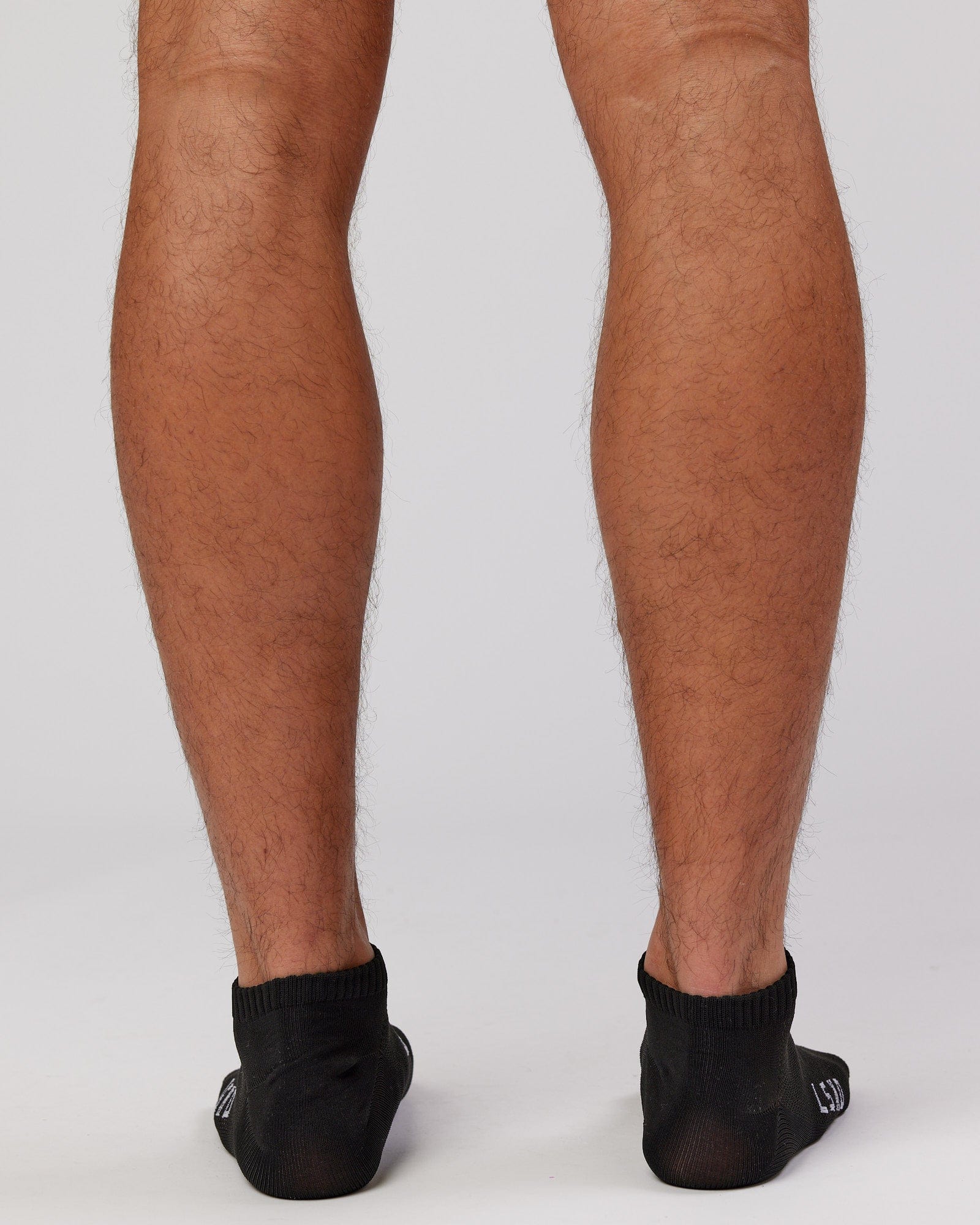 Model wearing Mens 3 Pack Covert Ankle Sock - Black