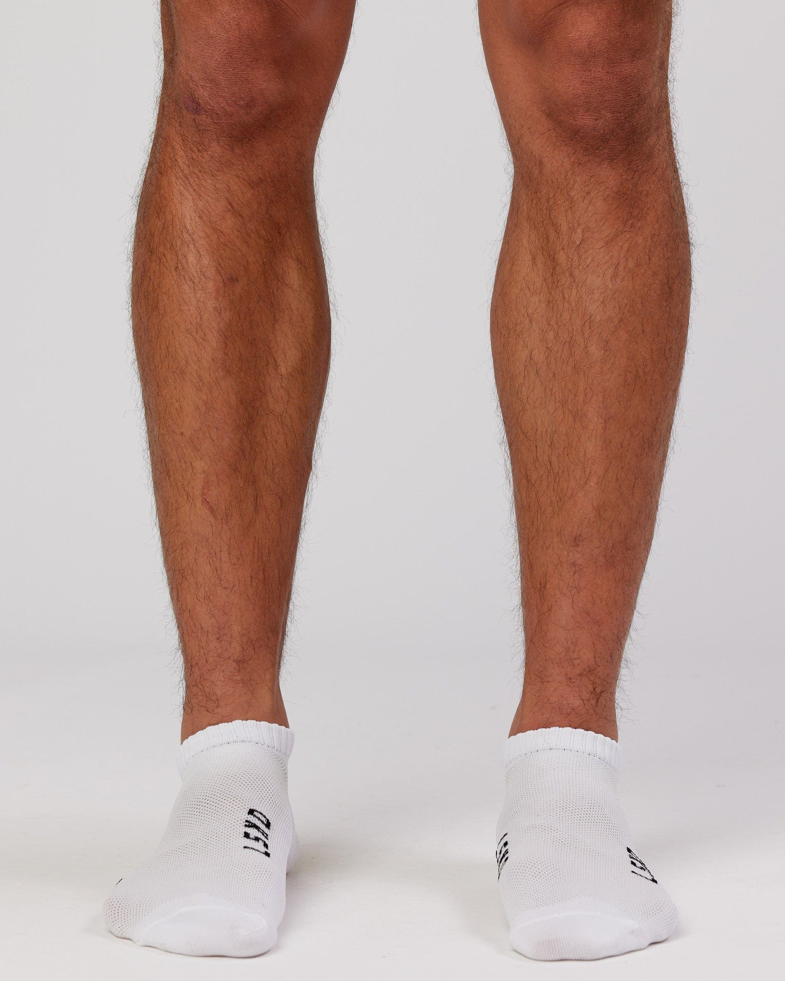 Model wearing Mens 3 Pack Covert Ankle Sock - White