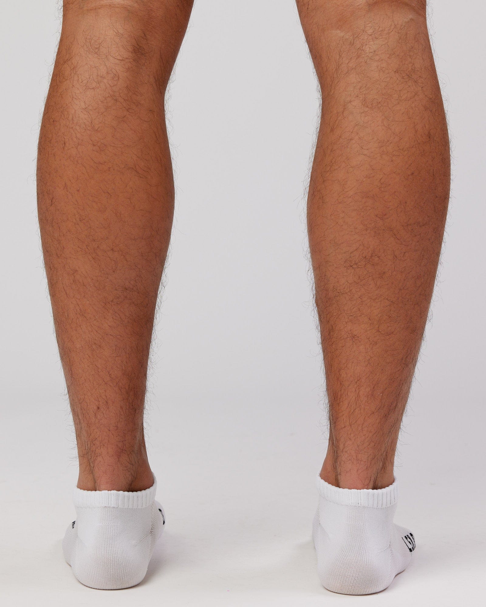 Model wearing Mens 3 Pack Covert Ankle Sock - White