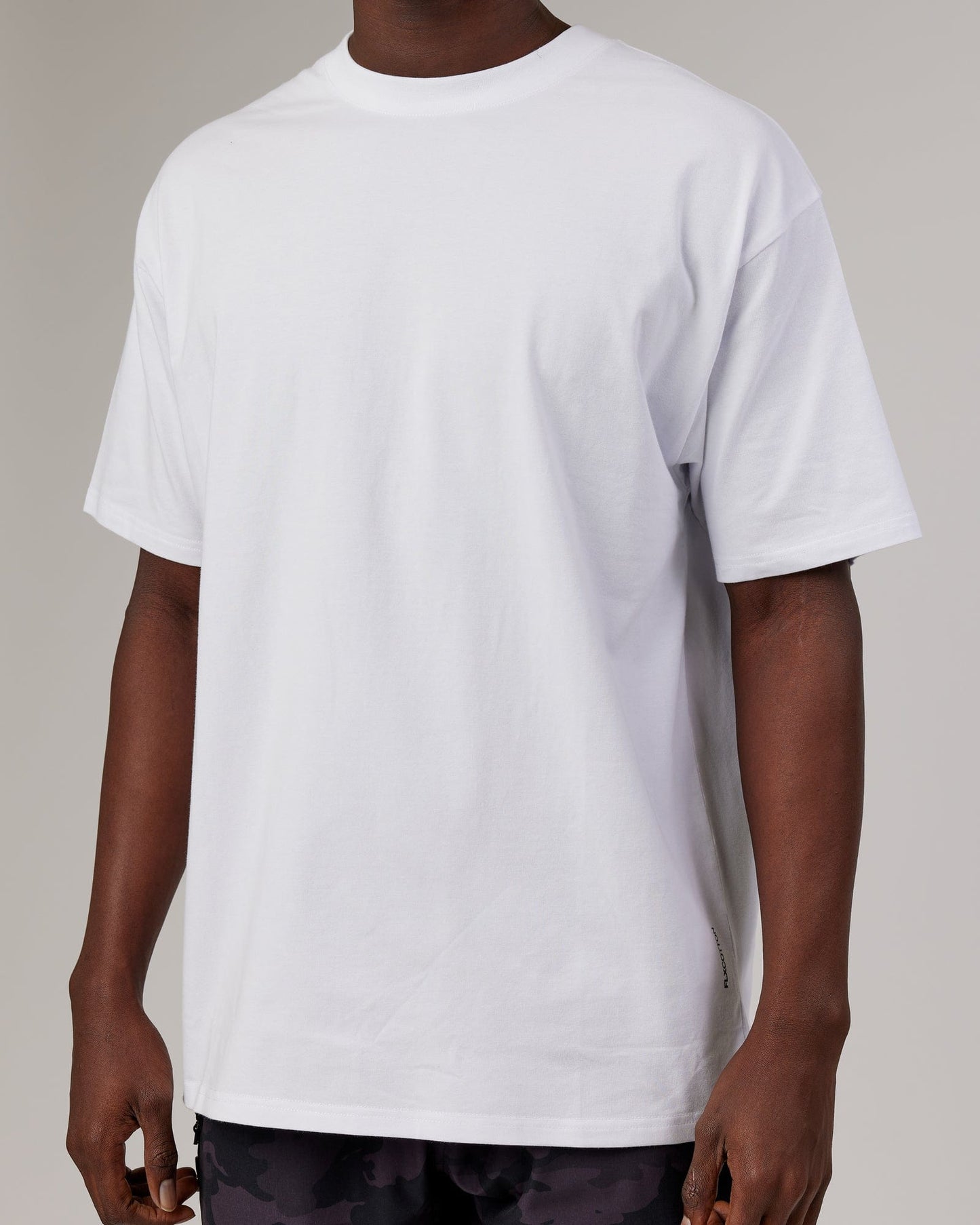 Model wearing DownLow FLXCotton Oversize Tee - White