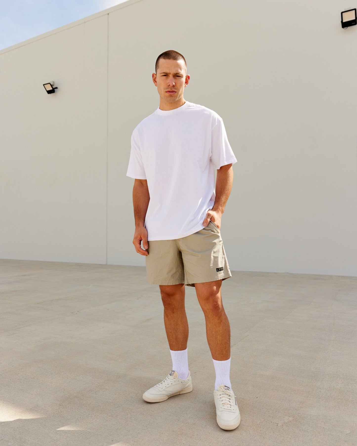 Model wearing DownLow FLXCotton Oversize Tee - White