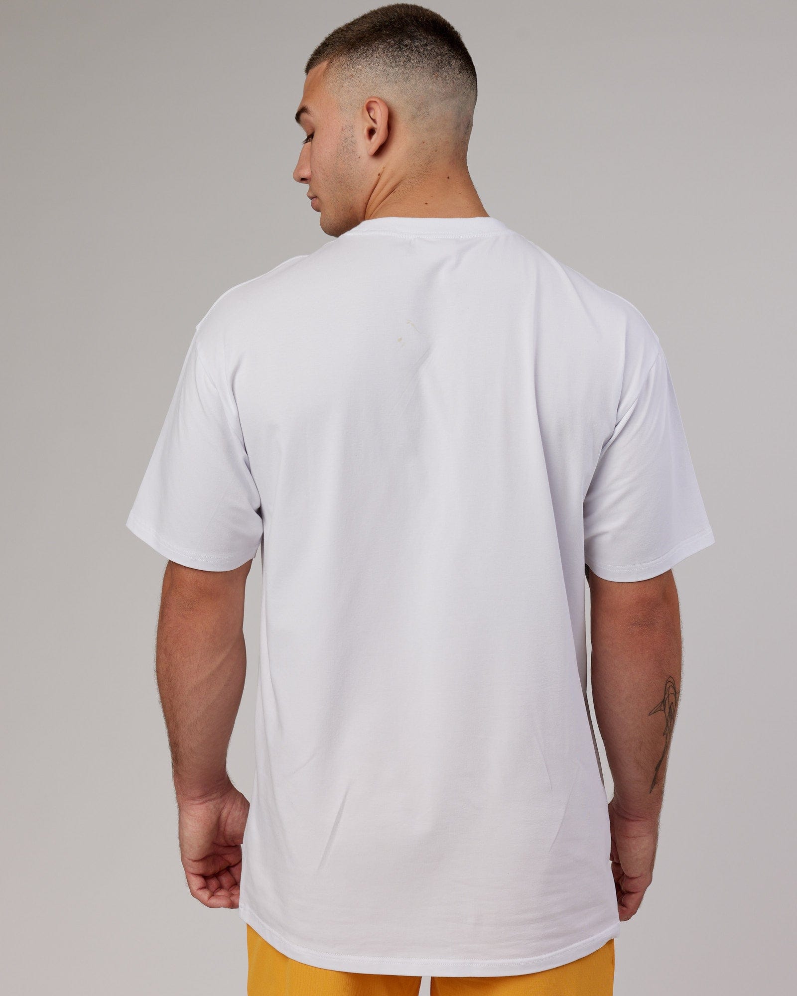 Model wearing Fundamental FLXCotton Tee Longline Oversize - White